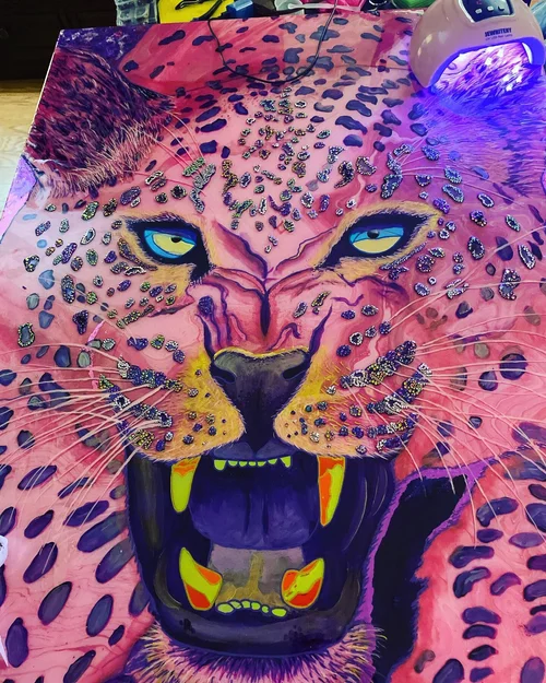 Colorful leopard face with glitter accents