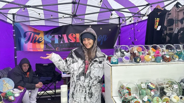 Smiling vendor at craft booth