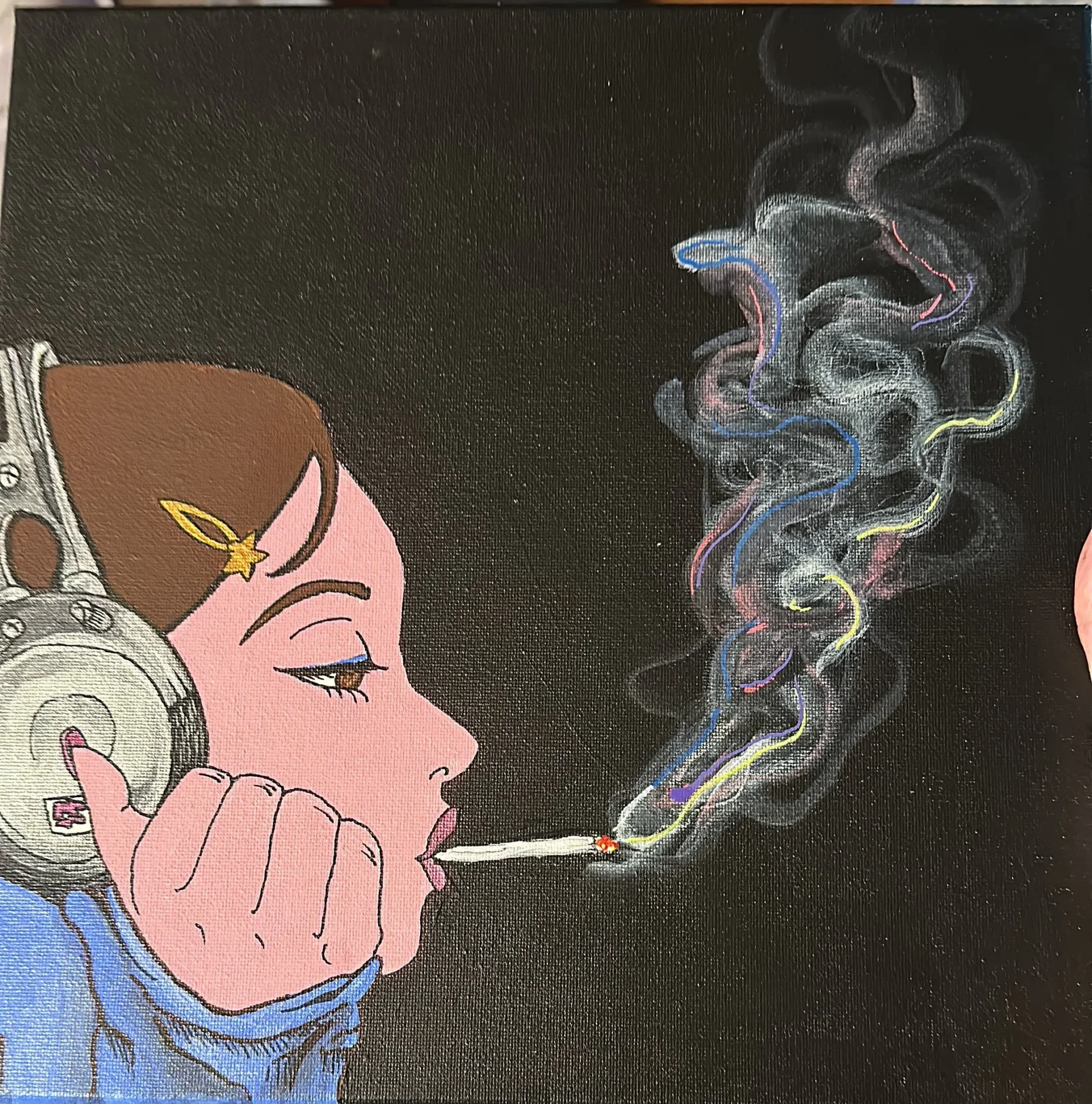 Artistic portrait of woman with cigarette smoke
