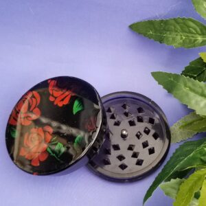 Black grinder with red rose design