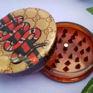 Decorative grinder with snake design
