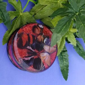 Coaster on leaves and blue background
