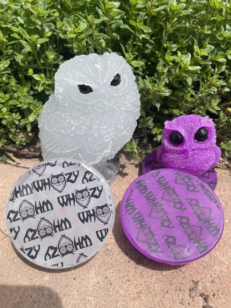 Translucent owl figurines with decorative lids