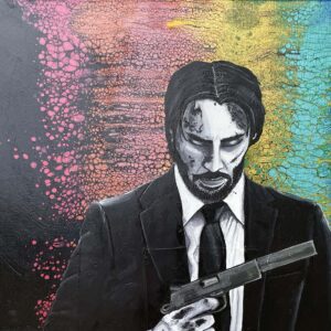 Man in suit holding a gun