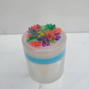 Scented candle topped with gummy bear shapes
