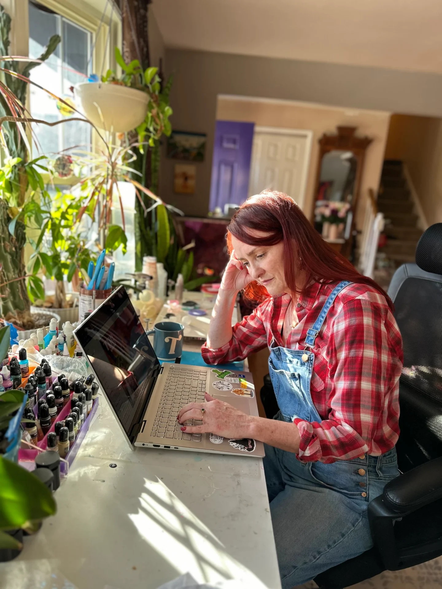 Woman working on a laptop at home
