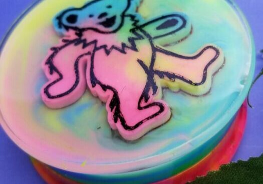Vibrant bear design with rainbow background