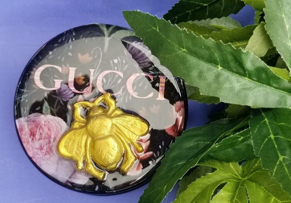 Decorative compact on purple background