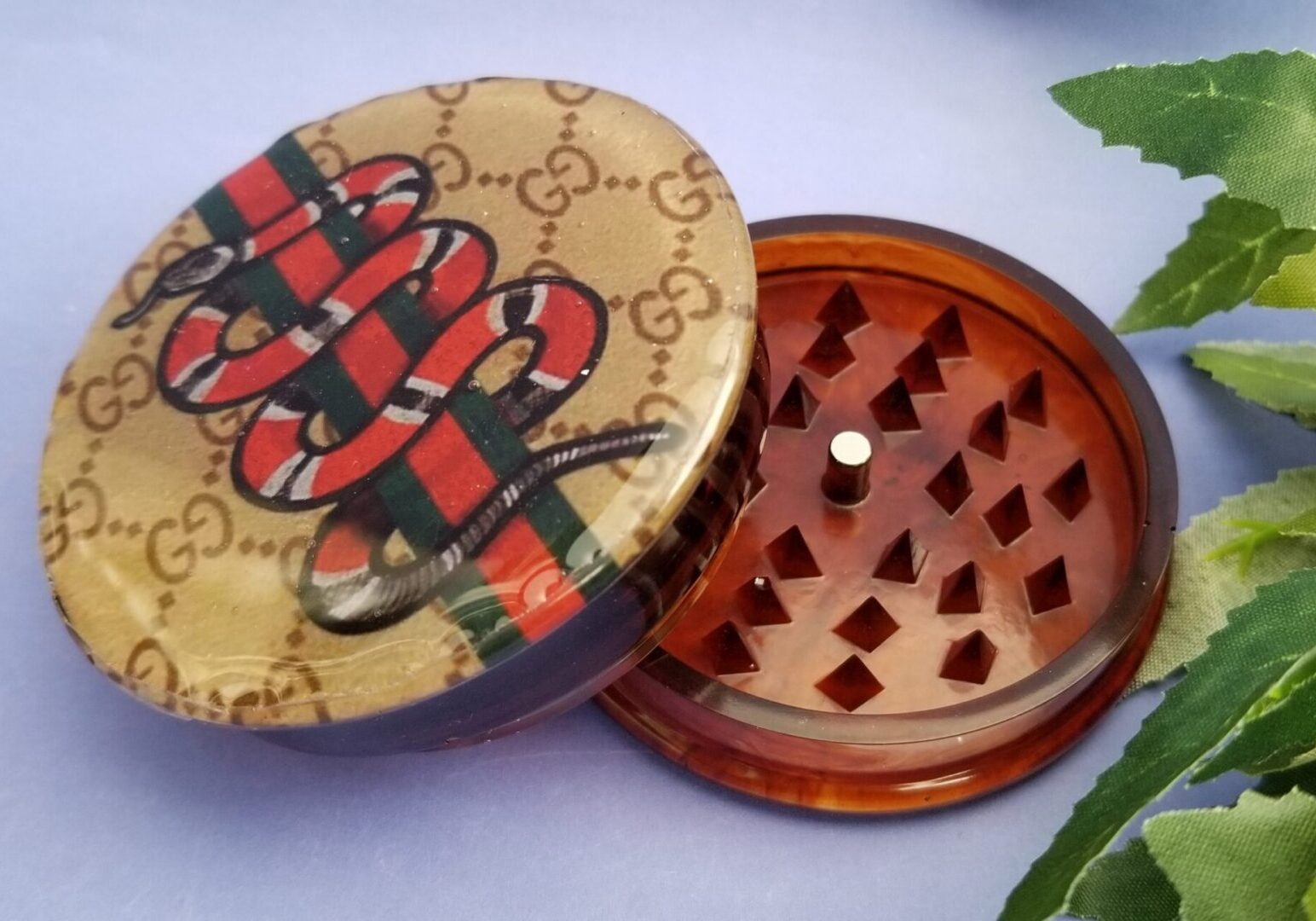 Decorative grinder with snake design