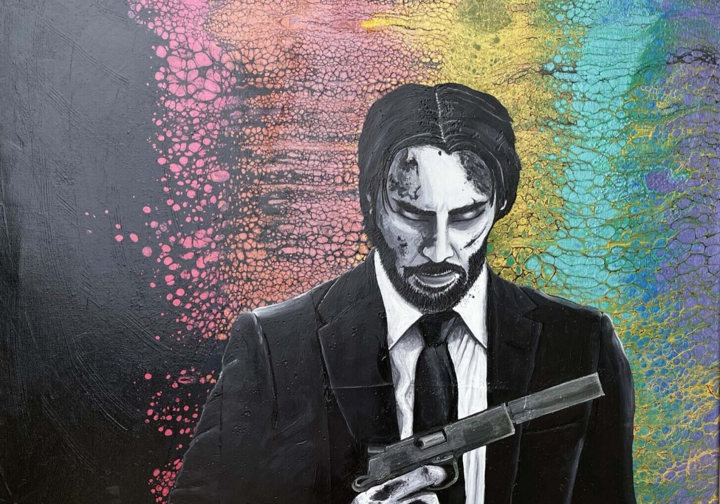 Man in suit holding a gun